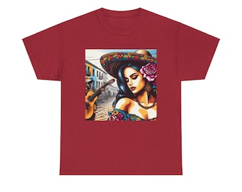 May include: A maroon t-shirt featuring a colorful illustration of a woman wearing a floral hat and a rose in her hair. The artwork depicts a woman with dark hair and a guitar player in the background. The design is set against a street scene.