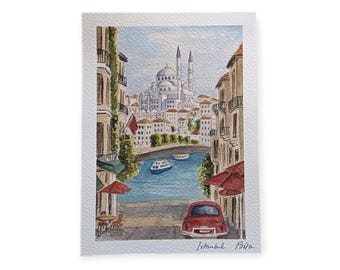 May include: Watercolour painting of an Istanbul cityscape featuring a red car. The artwork shows buildings, a bridge, and a mosque with minarets. The text "Istanbul Prita" is in the bottom right corner of the painting.