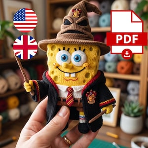 May include: A yellow, rectangular, crocheted figure resembling a sponge character wearing a brown, pointed, knit wizard hat with a crest, a black robe with a red and gold striped tie, and a Gryffindor-style emblem, holding two small brown wands.