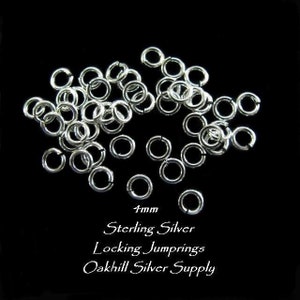 May include: A close-up of a pile of 4mm sterling silver locking jump rings. The jump rings are scattered on a black background. The text "4mm Sterling Silver Locking Jumprings Oakhill Silver Supply" is visible at the bottom of the image.