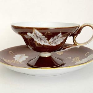 RARE FIND. Shafford Hand-Decorated Pedestal Teacup and Saucer. Gorgeous Chocolate Brown and White Leaves with Gold Trim. Bone China, 1960s