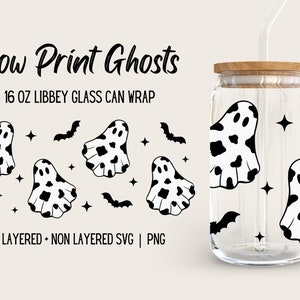 May include: A digital design for a 16 ounce glass can wrap featuring black and white cow print ghosts, bats, and stars. "Cow Print Ghosts" and "16 OZ LIBBEY GLASS CAN WRAP" are written in black text. "LAYERED + NON LAYERED SVG | PNG" is written in black text at the bottom of the design.