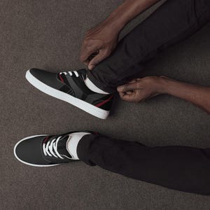 Black and Red Accent Skate Shoes - Sleek Canvas Sneakers for Men & Women