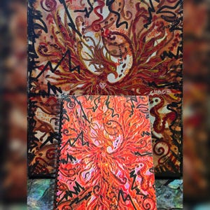 May include: Two paintings of a phoenix rising from the ashes. The top painting is on a canvas and the bottom painting is on a spiral bound notebook. Both paintings are in shades of red, orange, and yellow.