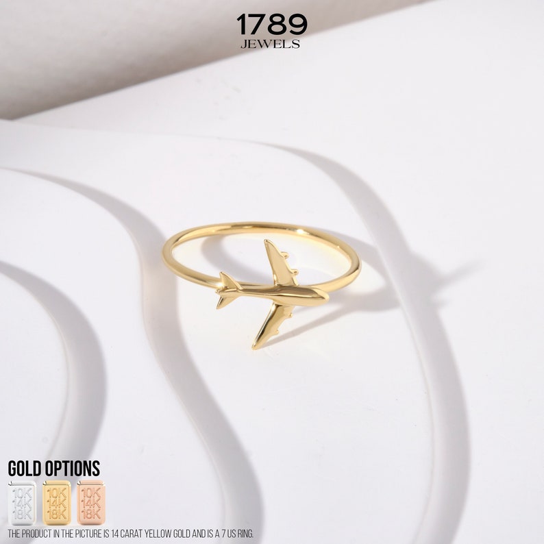 Celebrate your love for adventure with our traveler ring gold, a sleek and meaningful accessory for those always on the move. This stylish airplane ring 14K and Airplane ring gold design is perfect for any female pilot ring or aviation enthusiast. With its minimal plane ring design and elegant 18K stackable ring form, it's ideal for everyday wear. Whether you're looking for something gifted for hostess, travellers jewelry,