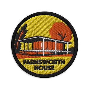 May include: Embroidered patch featuring the Farnsworth House in orange, white, and black. The design includes a stylized tree and leaf against a yellow background. The text "FARNSWORTH HOUSE" is in black.