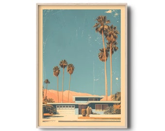 May include: A framed print featuring a mid-century modern home with a blue facade, set against a backdrop of palm trees and a mountain range. The artwork has a vintage aesthetic with a light blue sky and a beige frame.