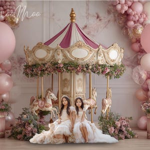 May include: A decorative carousel with a pink and white striped canopy, featuring floral arrangements and gold detailing. Two girls in white dresses are positioned in front of the carousel. Pink balloons and floral displays create a fairytale setting.