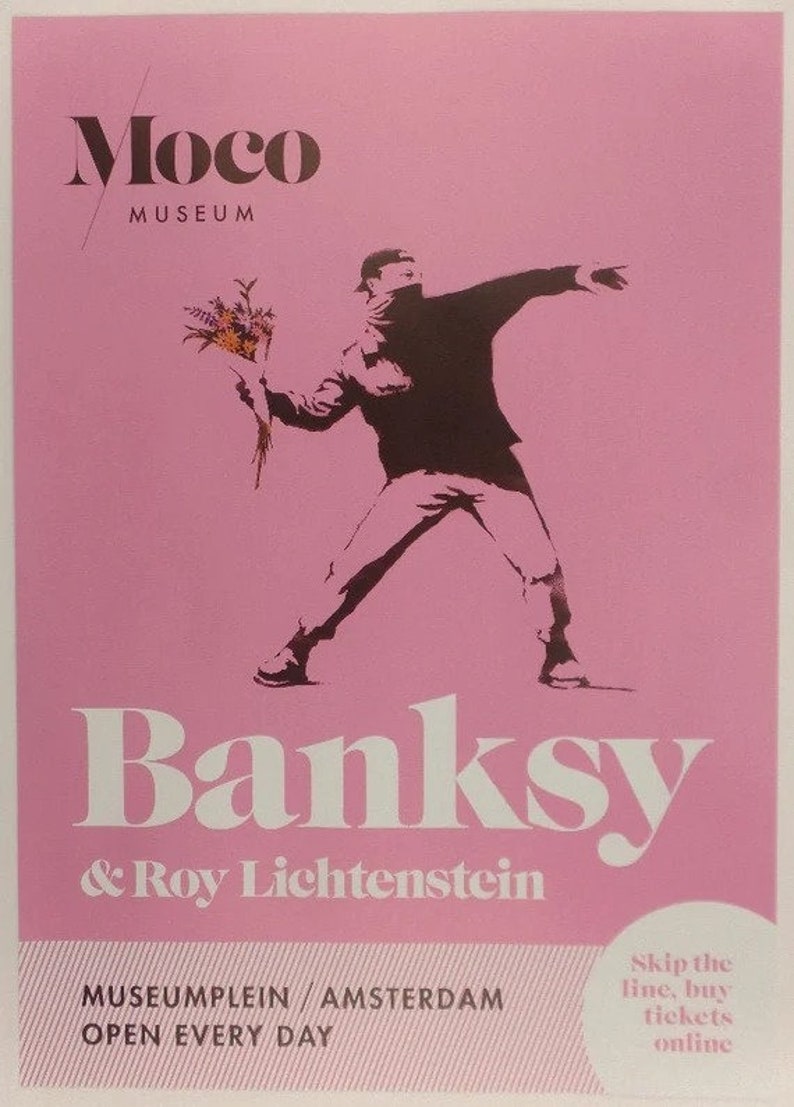 May include: A pink poster advertising an exhibition of Banksy and Roy Lichtenstein art at the Moco Museum in Amsterdam. The poster features a black and white image of a masked figure throwing a bouquet of flowers. The text on the poster reads "Banksy & Roy Lichtenstein" and "Museumplein Amsterdam, Open Every Day".