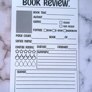 May include: A white rectangular book review sheet with the words "BOOK REVIEW:" at the top. It includes sections for book title, author, genre, format, page count, series name, overall rating, start and finish dates, summary, and quotes.