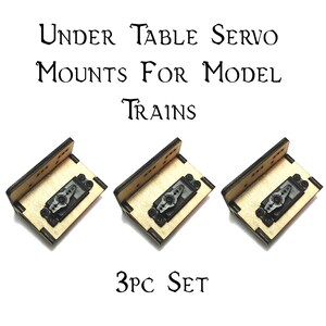 May include: Three wooden servo mounts for model trains. Each mount has a servo attached and is labeled "3PC SET".