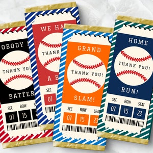 May include: Four baseball-themed chocolate bar wrappers with ticket-style designs. Each wrapper features a different baseball-related phrase: "Nobody Batter", "We Have A Slam", "Grand Slam", and "Home Run". Each wrapper has a red, white, and blue baseball graphic with the text "Thank You!" and a ticket-style section with the words "Sec", "Row", and "Seat".
