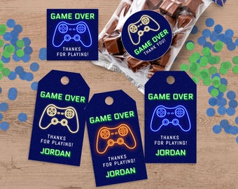 May include: A set of 4 blue and black favor tags with a neon green and yellow video game controller graphic. The tags say "Game Over" and "Thanks for Playing!" with the name "Jordan" at the bottom.