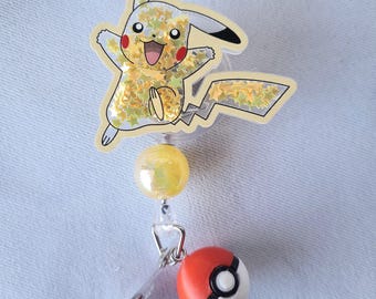 Carrete de insignias agitador de Pokémon, Pikachu, Dragonite, Eve, Togepi, Charmander y más.