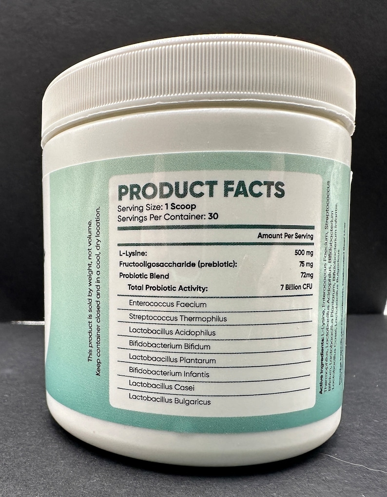 May include: White plastic container with a green label that reads "PRODUCT FACTS". The label lists the ingredients and amount per serving of a probiotic supplement. The ingredients include L-Lysine, Fructooligosaccharide, Enterococcus Faecium, Streptococcus Thermophilus, Lactobacillus Acidophilus, Bifidobacterium Bifidum, Lactobacillus Plantarum, Bifidobacterium Infantis, Lactobacillus Casei, and Lactobacillus Bulgaricus.
