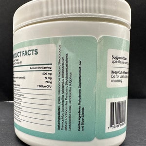 May include: White plastic container with a green label listing product facts and ingredients. The label includes a list of active ingredients, inactive ingredients, and suggested use. The container has a barcode on the side.
