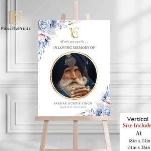 May include: A memorial sign on an easel with the text "IN LOVING MEMORY OF" and the name "SARDAR GURDIP SINGH". The sign includes a portrait, floral accents, and size options of 18in x 24in and 24in x 36in.