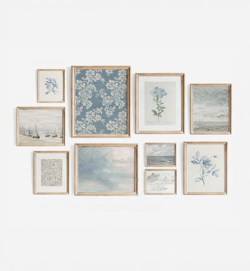 May include: A gallery wall of nine framed prints in a light wood frame. The prints feature a variety of subjects, including floral patterns, seascapes, and botanical illustrations. The prints are arranged in a staggered pattern, creating a visually appealing display.