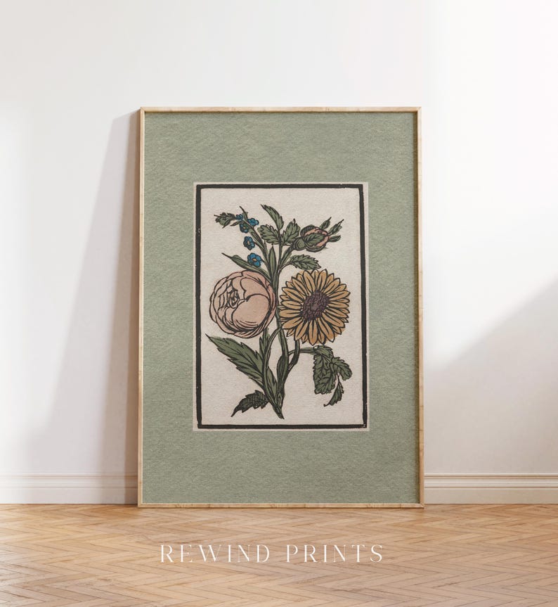 May include: A framed botanical print featuring a vintage illustration of a sunflower and a rose with green leaves and stems on a cream background. The frame is a light green color.