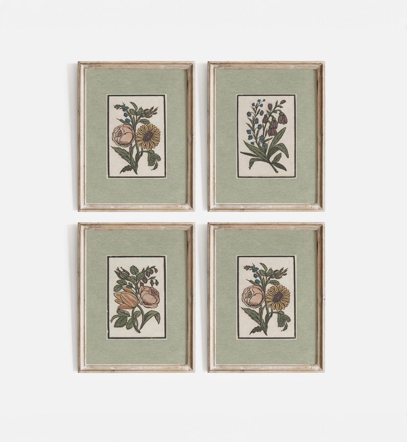 May include: Set of four framed botanical prints featuring different floral arrangements. Each print has a green background and a white border. The flowers are depicted in a vintage style with delicate details.