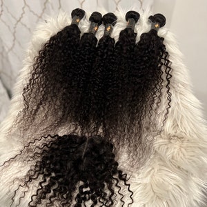 Wet and Wavy human hair bundles with closure