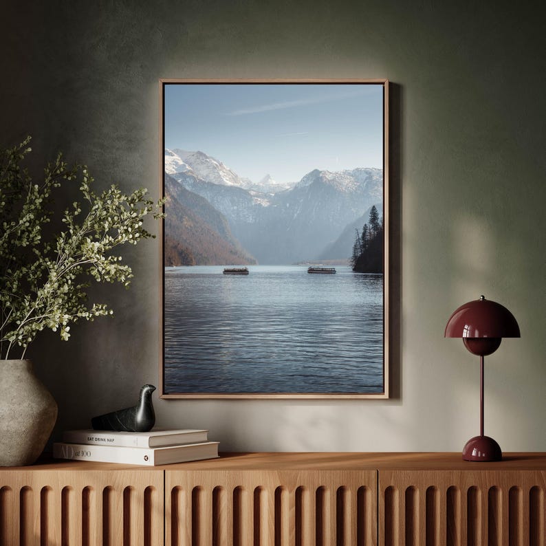 A room displaying a framed Digital Download of Konigssee, Berchtesgaden, capturing alpine majesty.