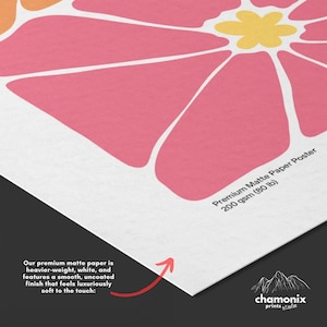 a close up of a paper with a flower on it