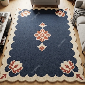 May include: A navy blue rectangular rug with a scalloped cream border. The rug features floral designs in cream and rust colors. The rug is placed on a wooden floor.