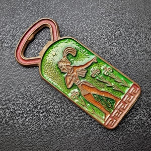 Vintage bronze bottle opener - Length: 9 cm.