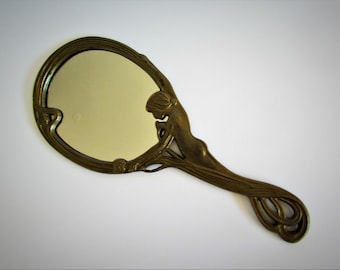 Miroir vintage en bronze 24,5 x 10,5 cm.