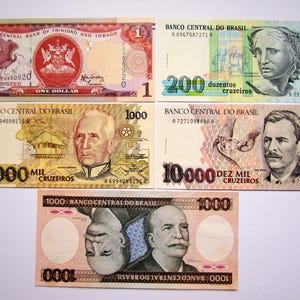 Puede incluir: Colección de billetes antiguos de Trinidad y Tobago y Brasil. Los billetes muestran varias denominaciones, incluido un dólar, 200, 1000 y 10000 cruzeiros. Los billetes presentan retratos y diseños intrincados.