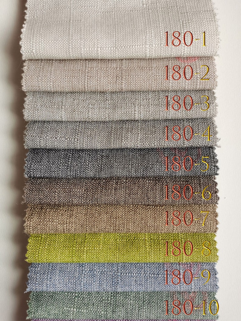 Puede incluir: Una pila de diez muestras de tela en varios colores, incluyendo beige, gris, marr&oacute;n y verde. Cada muestra est&aacute; etiquetada con un n&uacute;mero del 180-1 al 180-10. La tela tiene un tejido texturizado.