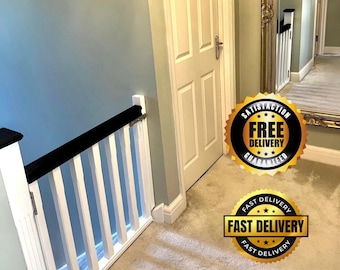 May include: A hallway with a white and black railing, a white door, and a large mirror. The wall is painted a light blue color. There are two gold-colored badges with the words "Satisfaction Free Delivery Guaranteed" and "Fast Delivery" on them.