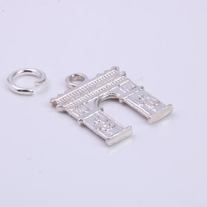 May include: Silver charm in the shape of an archway, with a small silver jump ring.