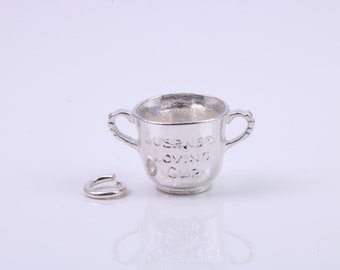 Dije de trofeo deportivo, dije tradicional, elaborado en plata de ley maciza de grado 925, completo con eslabón de sujeción