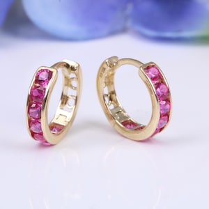 10 mm round hinged hoop earrings, made from solid yellow gold and set with Ruby Red Cubic Zirconia