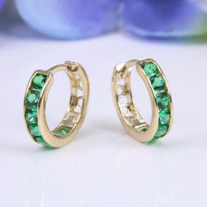 10 mm round hinged hoop earrings, made from solid yellow gold and set with Emerald Green Cubic Zirconia