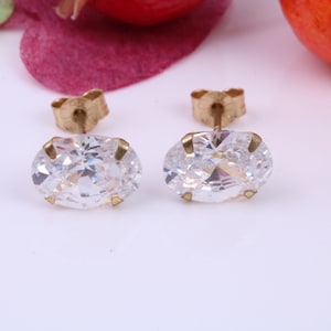 Oval cut Cubic Zirconia set Stud Earrings, Measures 8 x 6 mm, Made from Solid 9ct Yellow Gold