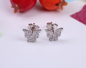May include: A pair of silver butterfly earrings with clear cubic zirconia stones.
