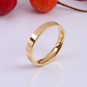 Bande simple de 3 mm de large, profil plat, en argent massif et en or jaune 18 carats