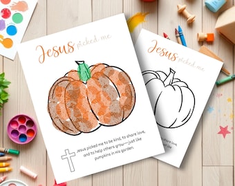 May include: Two white paper prints with pumpkin designs. One is colored with orange and brown fingerprints, the other is a black outline. Text reads "Jesus picked me" and a message about kindness.