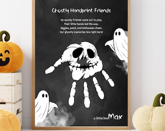 May include: A framed print with the text "Ghostly Handprint Friends" and a handprint design resembling a skull. The artwork features ghost illustrations and the text "a little boo Max". The background is dark.