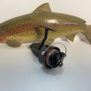 Vintage Mitchell Garcia 300 Fishing Reel: Iconic Gold Standard