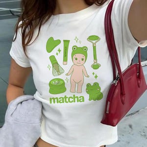 Matcha Sonny Angel Baby Tee Y2K 90s Trendy Kewpie Cherub Shirt Self Care Graphic Tee Matcha Bowl Kitchen Art Girly Matcha Lover Gift for Her