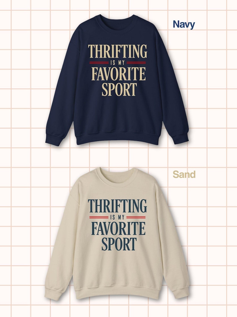 May include: Navy blue and sand-colored sweatshirts. Each sweatshirt features the text "THRIFTING IS MY FAVORITE SPORT" in a bold, vintage-inspired font. The text is in white and navy blue, with red accent lines.