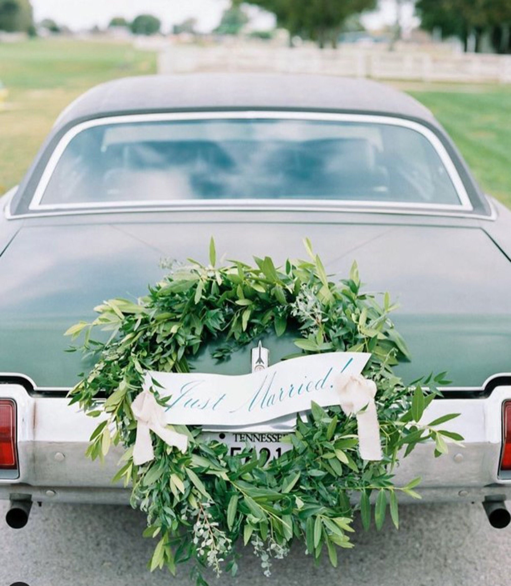 Beautiful wedding car with plate JUST MARRIED Stock Photo