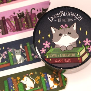 May include: A black and white cat with pink flowers sits on a stack of books with the text "Doombloomart ~ 10 meters ~ Cats x Literature Washi Tape" on a black background.