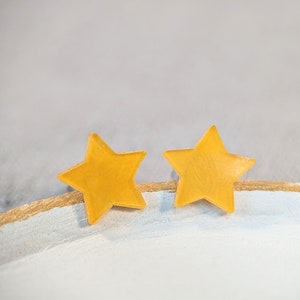 Yellow star earrings sale