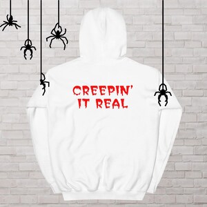 CREEPIN&#39; IT REAL Hoodie, Halloween Sweatshirt in White with Red graphics, Skeleton Peace hand on front, text on back