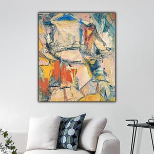 May include: A rectangular canvas painting featuring an abstract composition with thick, visible brushstrokes in shades of cream, yellow, orange, blue, and black. The artwork displays a series of overlapping geometric shapes and lines.